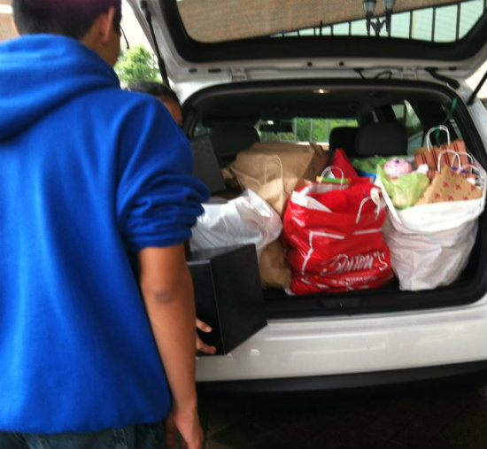 unloading the teddy bear bags from the car